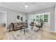 Comfortable living room with neutral tones, contemporary furnishings, and plenty of natural light at 60 Fenwick Hall Aly # 415, Johns Island, SC 29455