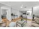 Inviting living room featuring an open layout, a stylish coffee table, and views of the modern kitchen at 60 Fenwick Hall Aly # 415, Johns Island, SC 29455