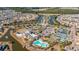 Stunning aerial view of a Primary-planned community featuring a pool, clubhouse, and waterfront homes at 626 Battery Edge Dr, Summerville, SC 29486