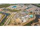 Community aerial view showing the clubhouse, pool, meandering ponds, and manicured landscape at 626 Battery Edge Dr, Summerville, SC 29486