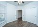 This bedroom features a wood floor, ceiling fan, and closet at 626 Battery Edge Dr, Summerville, SC 29486
