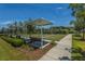 Multiple bocce ball courts with shaded benches surrounded by lush landscaping at 626 Battery Edge Dr, Summerville, SC 29486