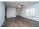 Open living room features modern ceiling fan, neutral paint, hardwood flooring, and natural light at 626 Battery Edge Dr, Summerville, SC 29486