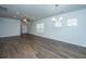 Living room with a ceiling fan and wood flooring flowing into dining area at 626 Battery Edge Dr, Summerville, SC 29486
