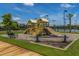 Community playground with slides and climbing structures, complemented by a shaded seating area at 626 Battery Edge Dr, Summerville, SC 29486