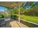 Enjoy outdoor living on this screened porch with a ceiling fan and lovely view of the landscaped backyard at 626 Battery Edge Dr, Summerville, SC 29486