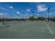 Outdoor tennis courts featuring nets, lighting, and newly resurfaced courts at 626 Battery Edge Dr, Summerville, SC 29486