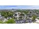 Scenic aerial view showcases a mix of residential and commercial properties amidst lush greenery at 634 Rutledge Ave, Charleston, SC 29403