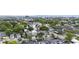 Scenic aerial view showcases a mix of residential and commercial properties amidst lush greenery at 634 Rutledge Ave, Charleston, SC 29403