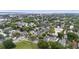 Picturesque aerial view highlights a vibrant community with tree-lined streets and diverse housing options at 634 Rutledge Ave, Charleston, SC 29403