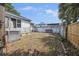 Backyard features mature trees, a concrete retaining wall, and plenty of space at 634 Rutledge Ave, Charleston, SC 29403