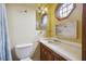 Well-lit bathroom featuring vanity with sink, cabinet, and toilet at 634 Rutledge Ave, Charleston, SC 29403