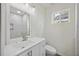 Bright bathroom featuring a solid surface vanity, and a built-in tiled shower at 634 Rutledge Ave, Charleston, SC 29403
