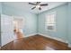 Light-filled bedroom with hardwood floors and a ceiling fan at 634 Rutledge Ave, Charleston, SC 29403