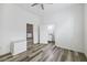 Bedroom featuring wood-look flooring, closet, and an ensuite bathroom with a granite countertop at 634 Rutledge Ave, Charleston, SC 29403