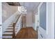 Spacious foyer with hardwood floors and staircase leading to the upper level at 634 Rutledge Ave, Charleston, SC 29403