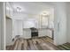 Bright kitchen with white cabinetry, granite counters, stainless appliances, and open layout at 634 Rutledge Ave, Charleston, SC 29403