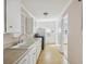 White galley kitchen featuring essential appliances and ample cabinet space at 634 Rutledge Ave, Charleston, SC 29403