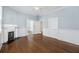 Bright living room features hardwood floors, a fireplace, and built-in shelving at 634 Rutledge Ave, Charleston, SC 29403