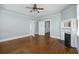 Open living room with hardwood floors, a fireplace, and ample natural light at 634 Rutledge Ave, Charleston, SC 29403