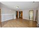 Bright, spacious living room with hardwood floors and multiple entryways at 634 Rutledge Ave, Charleston, SC 29403