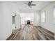 Open living space with modern floors that seamlessly connects to a well-equipped kitchen at 634 Rutledge Ave, Charleston, SC 29403