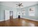 Spacious living room featuring hardwood floors, a decorative fireplace, and natural light at 634 Rutledge Ave, Charleston, SC 29403
