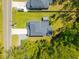 Aerial view of the home showcasing the property layout, driveway, and surrounding landscape at 689 W Butternut Rd, Summerville, SC 29483