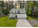 Aerial view of a two-story home featuring a well-maintained lawn and an attached two-car garage at 689 W Butternut Rd, Summerville, SC 29483