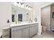 Bright bathroom features a double vanity and ample lighting above at 689 W Butternut Rd, Summerville, SC 29483