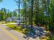 Suburban home with a large yard and mature trees at 689 W Butternut Rd, Summerville, SC 29483