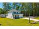 Exterior elevation of a two-story home with a well-manicured lawn and mature trees at 689 W Butternut Rd, Summerville, SC 29483