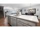 Open floor plan showing the kitchen island, living room, dining area, and hardwood floors at 689 W Butternut Rd, Summerville, SC 29483