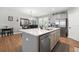 Kitchen featuring a large island with a sink, stainless steel appliances, and ample counter space at 689 W Butternut Rd, Summerville, SC 29483