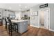Modern kitchen with gray cabinets, quartz countertops, a large island, and stainless steel appliances at 689 W Butternut Rd, Summerville, SC 29483