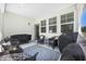 Covered patio featuring outdoor seating, grill, and a decorative area rug at 689 W Butternut Rd, Summerville, SC 29483