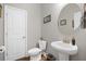 Stylish half bath with modern fixtures and elegant decor at 689 W Butternut Rd, Summerville, SC 29483