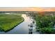 Waterfront property featuring a private dock, serene water views, and nearby marsh at 6910 Tanner Hall Blvd, Hanahan, SC 29410