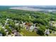 Scenic aerial view showcasing neighborhood homes amid lush trees and serene marshland at 6910 Tanner Hall Blvd, Hanahan, SC 29410