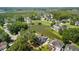Beautiful community aerial view with homes surrounding scenic pond and lush green landscaping at 6910 Tanner Hall Blvd, Hanahan, SC 29410