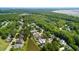 Scenic aerial view showcases neighborhood homes amid lush trees and serene marshland at 6910 Tanner Hall Blvd, Hanahan, SC 29410