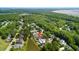 Scenic aerial view showcases neighborhood homes amid lush trees and serene marshland at 6910 Tanner Hall Blvd, Hanahan, SC 29410