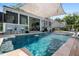 Beautiful pool area with fountain features, mature landscaping, and a covered patio for outdoor entertaining at 6910 Tanner Hall Blvd, Hanahan, SC 29410