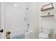 Bright bathroom featuring a tub with shower and white subway tile at 6910 Tanner Hall Blvd, Hanahan, SC 29410