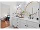 Bathroom features white cabinets, double sinks, and modern fixtures at 6910 Tanner Hall Blvd, Hanahan, SC 29410