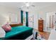Well-lit bedroom with stylish turquoise curtains and modern furnishings at 6910 Tanner Hall Blvd, Hanahan, SC 29410