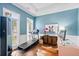 Office boasts lots of natural light, decorative art, and is perfect for remote work at 6910 Tanner Hall Blvd, Hanahan, SC 29410