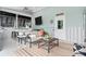 Relaxing outdoor patio with comfortable seating, a bar, and a ceiling fan, perfect for entertaining at 6910 Tanner Hall Blvd, Hanahan, SC 29410