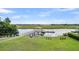 Waterfront view of covered dock and seating area perfect for enjoying the marsh views at 6910 Tanner Hall Blvd, Hanahan, SC 29410