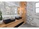 Elegant bathroom featuring marble tile, and sinks, walk-in shower and modern finishes at 71 Moultrie St, Charleston, SC 29403